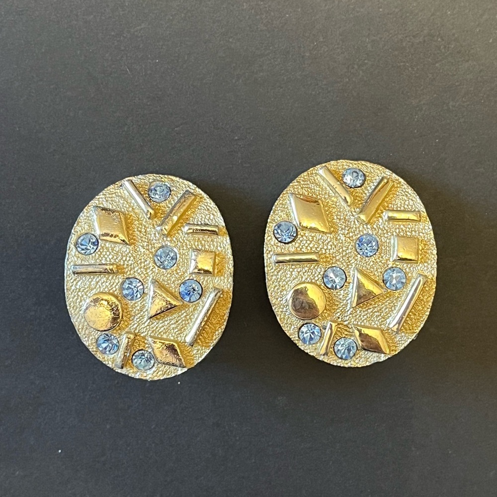 Sarah Coventry Gold Tone Clip Earrings with Light Sapphire Blue Rhinestones